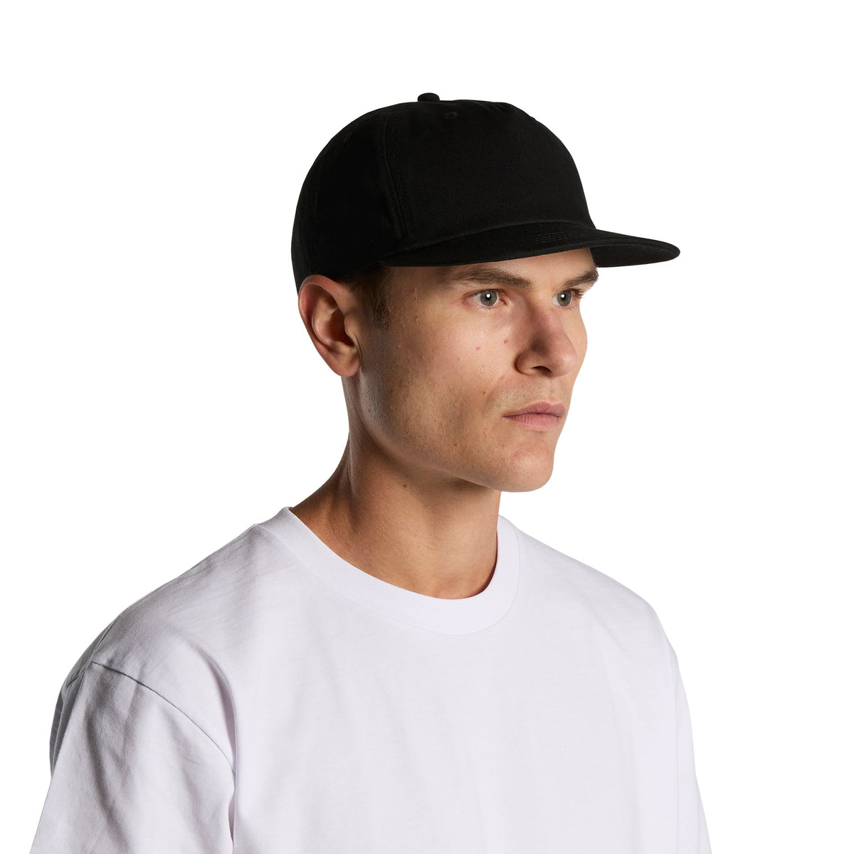 Custom printed AS Colour Surf Cotton Cap in Black, three-quarter view on model